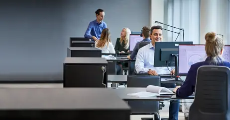 employees working in large open office environment