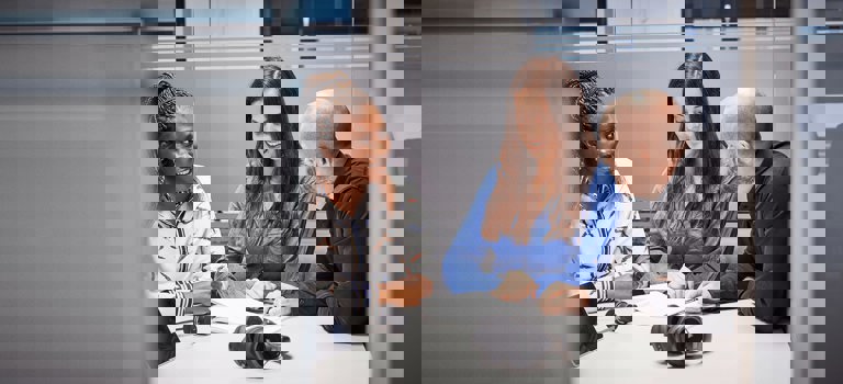 RTX employees in a meeting