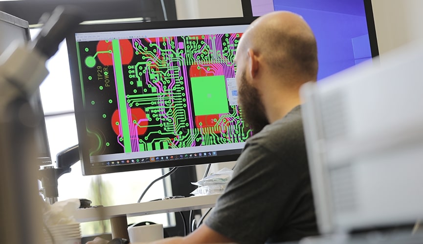 employee designing product hardware on computer 